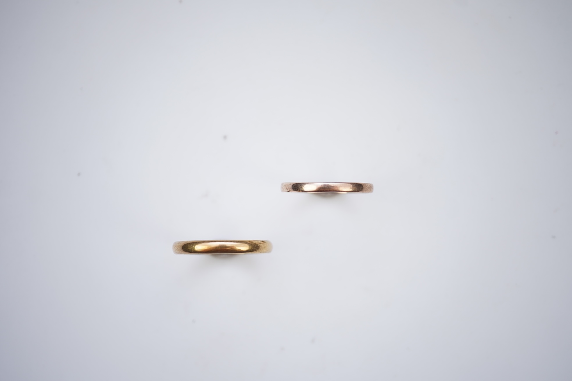 Two gold wedding bands